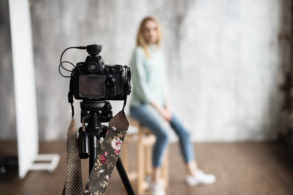 backstage to photoshooting in studio with professional photo camera