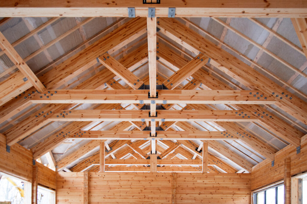 roof construction of big wooden trusses closeup