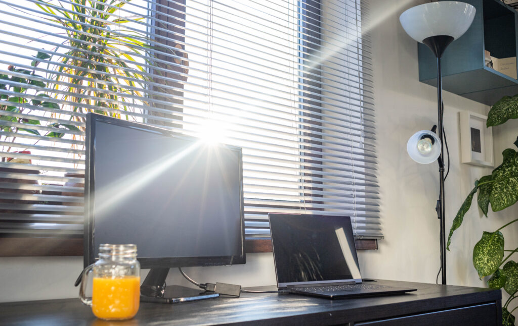 home office interior with desk space at sunset