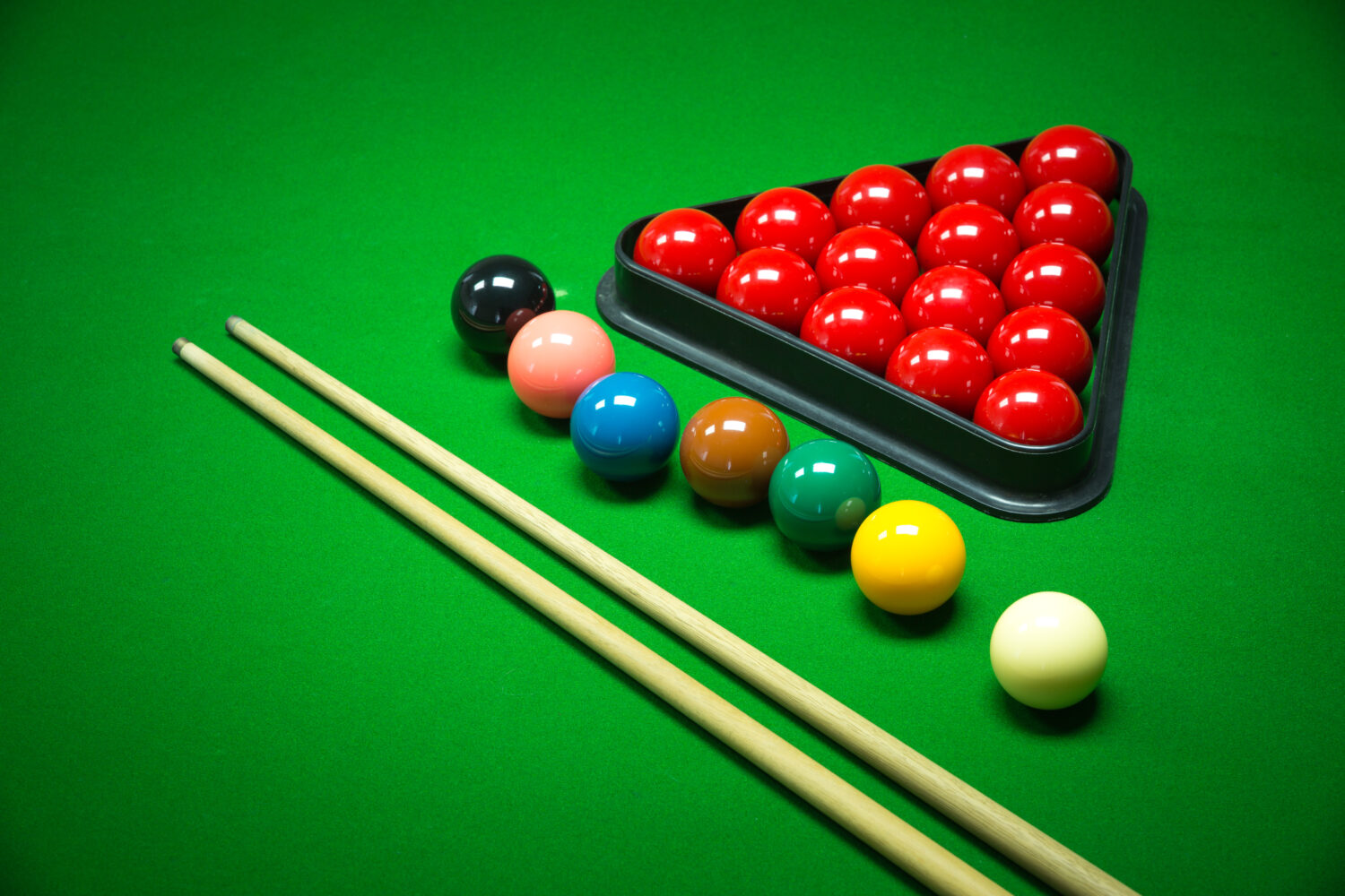 snooker balls set on a green table