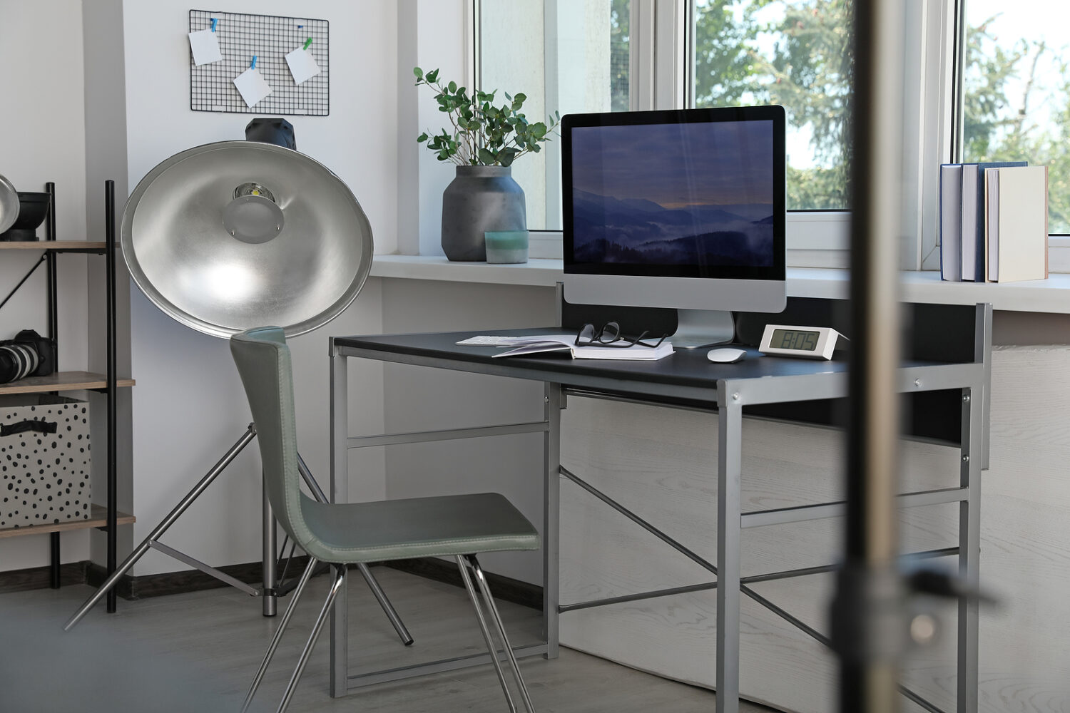 Professional lighting equipment and comfortable workplace in photo studio. Interior design