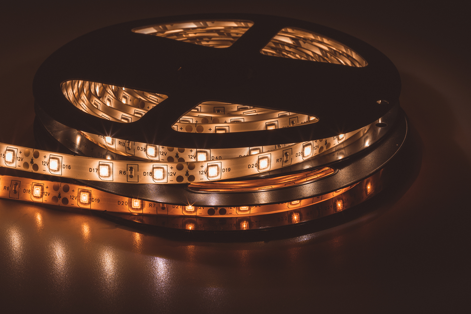 From Above Bobbin With Roll Of Glowing Led Strip Lighting