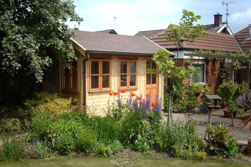 traditional garden sun room with wooden panels