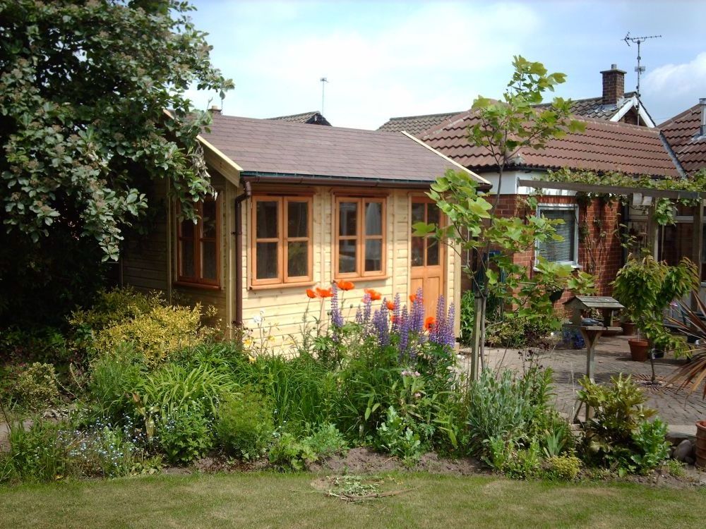 traditional garden sun room with wooden panels