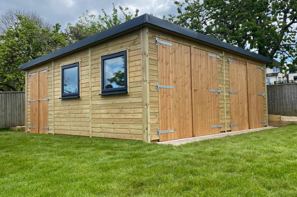 mono roof triple door garage with black trim windows