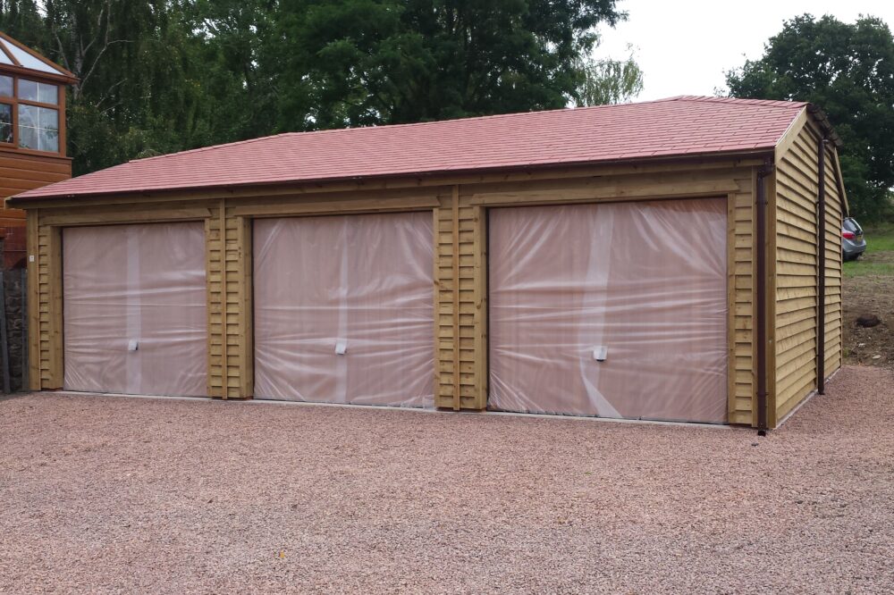Timber garage with a hipped roof