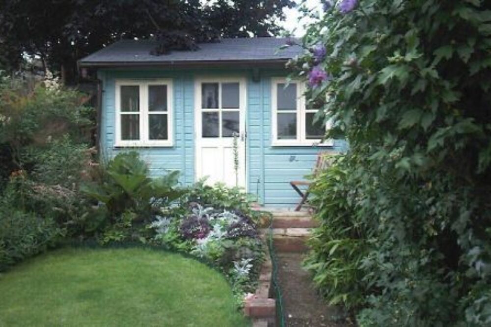 Traditional blue garden studio