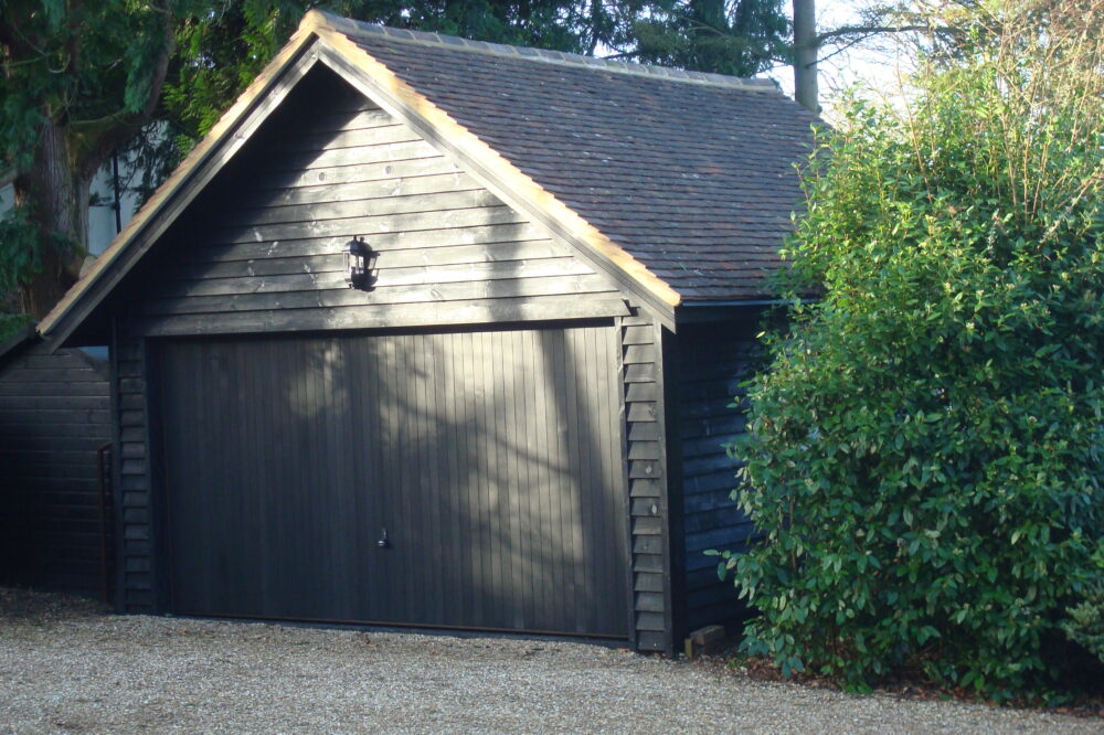 Oak framed garage with a clay tiled roof