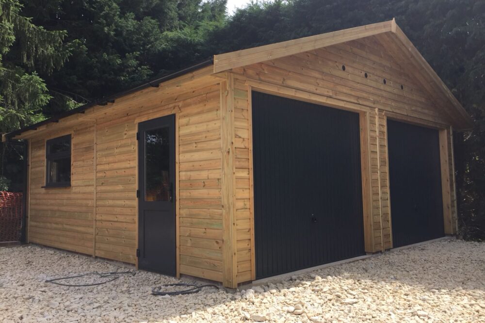 Timber garage with anthracite grey doors and windows
